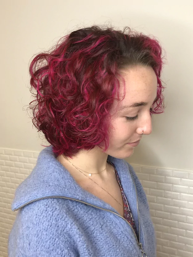 Artistique Hair Studio red color hair treatment result on a woman