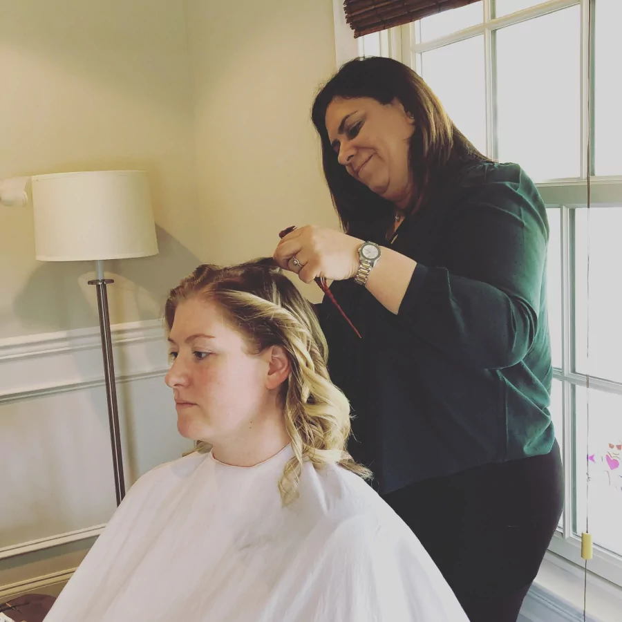 Stylist María F. Gómez working on a hair styling